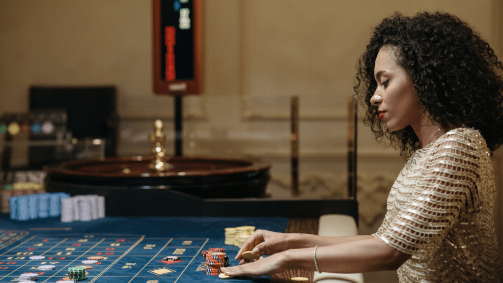 A person playing roulette at a casino