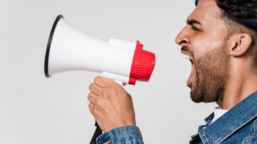 a person shouting into a megaphone