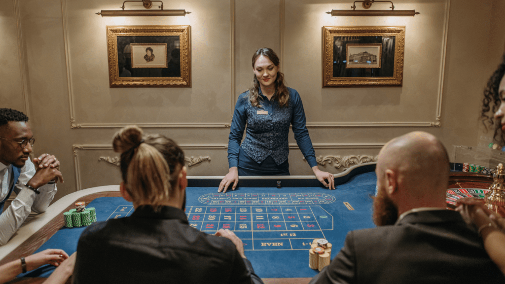 a group of people playing roulette at a casino table