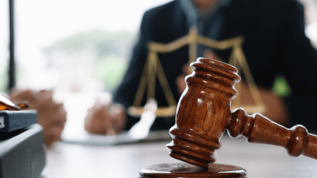 judge's gavel on a desk in a courtroom