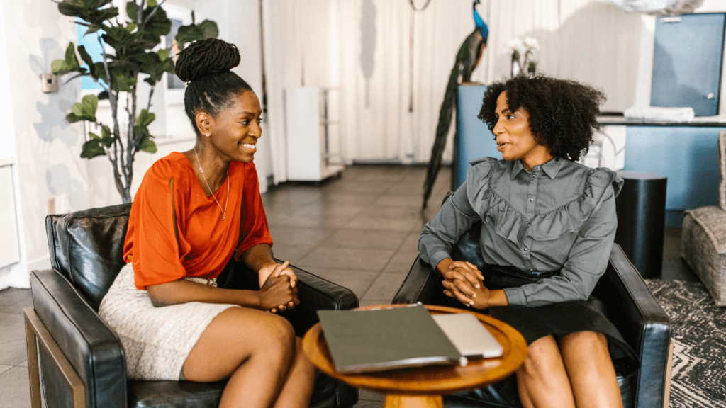 two people talking in an office setting