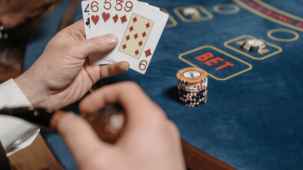 a group of people playing blackjack at a casino table