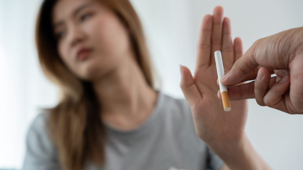 a person holding an electronic cigarette in their hand