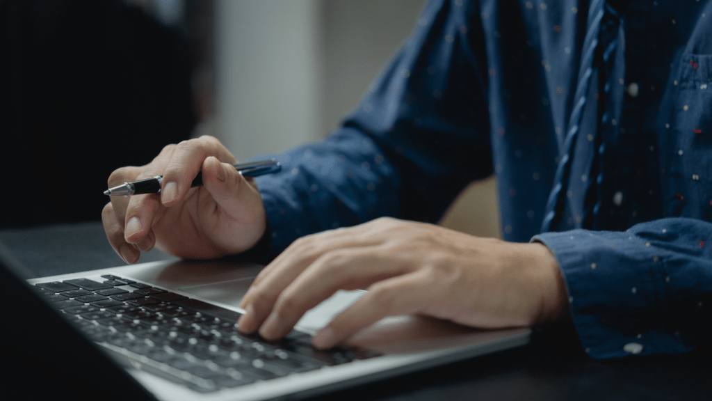 a person typing on a computer