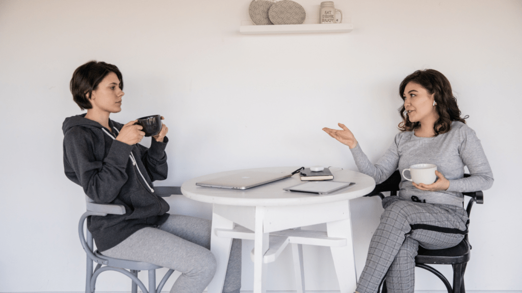 two people talking in an office setting